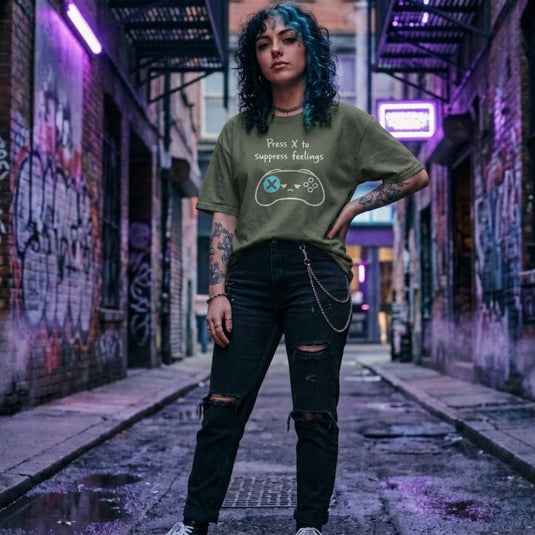 Translation missing: en.Military green gamer shirt graphic showing a sad video game controller with text reading Press X to suppress feelings. 