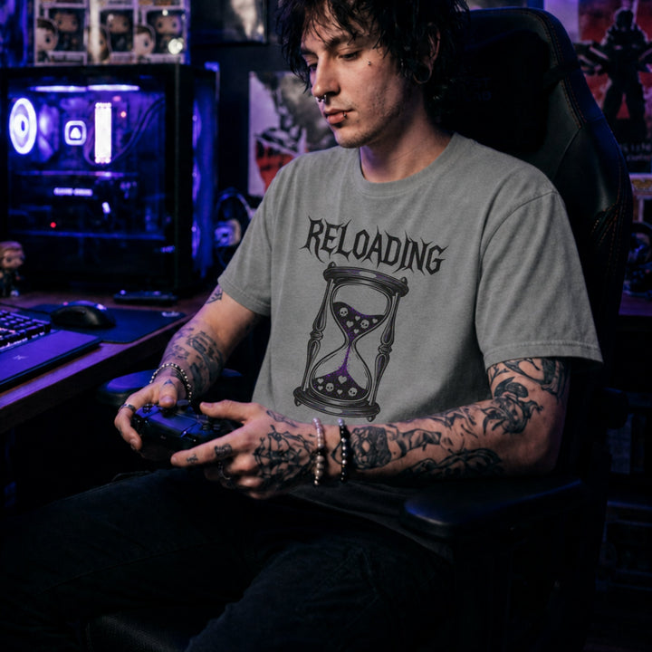 Translation missing: en.Graphite heather gamer shirt graphic with text RELOADING and hourglass filled with purple glitter sand hearts and skulls