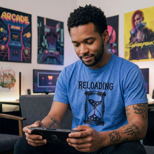 Translation missing: en.Heather royal gamer shirt graphic with text RELOADING and hourglass filled with purple glitter sand hearts and skulls