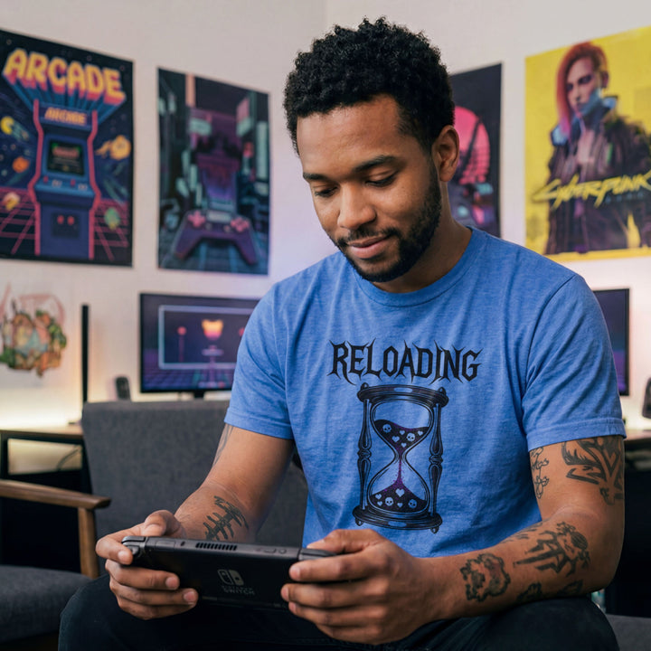 Translation missing: en.Heather royal gamer shirt graphic with text RELOADING and hourglass filled with purple glitter sand hearts and skulls