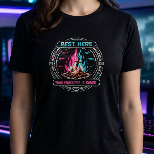 Translation missing: en.Black shirt with a pink and teal cyber bonfire emblem reading Rest Here, Your Progress Is Saved