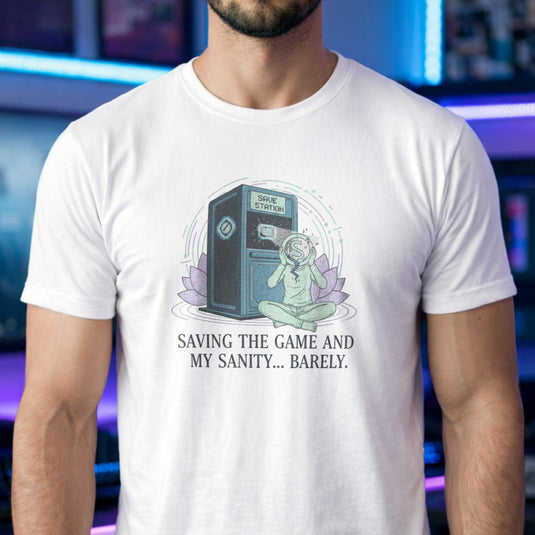 Translation missing: en.White tee with a meditating figure holding a cracked head by a Save Station. Text: Saving the game and my sanity