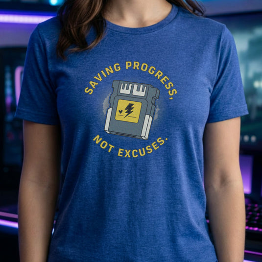 Translation missing: en.Heather royal t-shirt with yellow text reading Saving Progress, Not Excuses around a retro console memory card icon