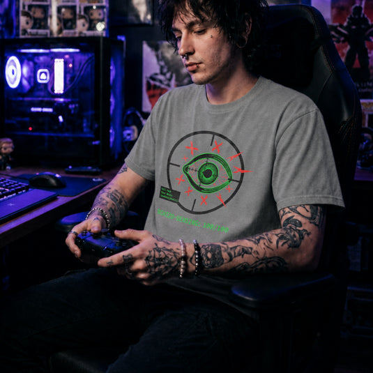 Translation missing: en.Green eye in a crosshair target with red Xs, a green kill feed text box, and Schizo Sensing on a sports grey tee shirt