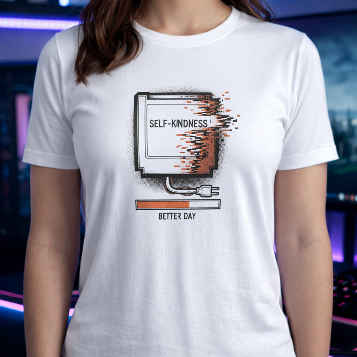 Translation missing: en.White tee with a retro gaming cartridge labeled Self-Kindness glitching above a Better Day orange loading bar