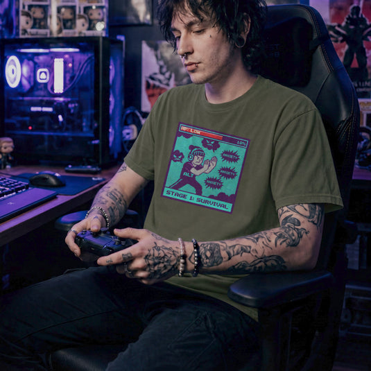 Translation missing: en.Military green gamer shirt pixel graphic with low HP health bar and character fighting anxiety bubbles reading STAGE 1: SURVIVAL