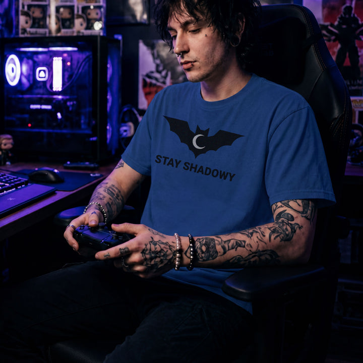 Translation missing: en.Heather royal gamer mental health graphic tee featuring a black bat and crescent moon with Stay Shadowy text