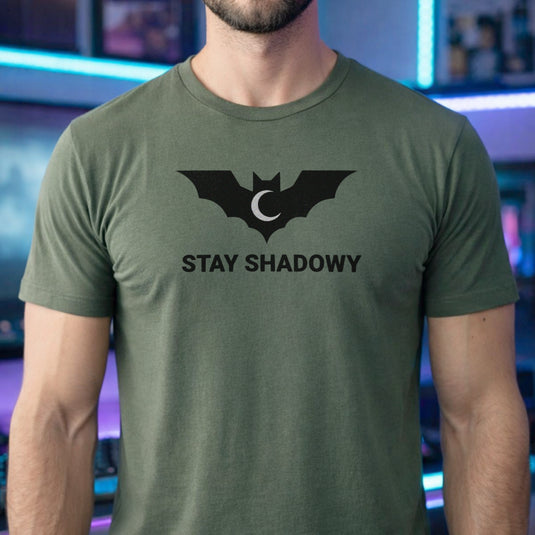Translation missing: en.Military green gamer mental health graphic tee featuring a black bat and crescent moon with Stay Shadowy text