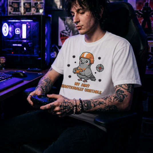 Translation missing: en.White tee with cartoon pigeon gamer graphic and text, "MY AIM? EMOTIONALLY UNSTABLE