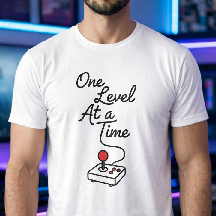Translation missing: en.White cotton tee with retro arcade joystick graphic and text "One Level At A Time"