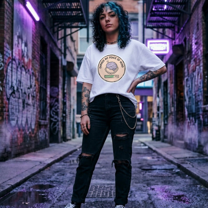 Translation missing: en.White cotton tee with brain illustration coin graphic and text "EARNED MY PEACE OF MIND"