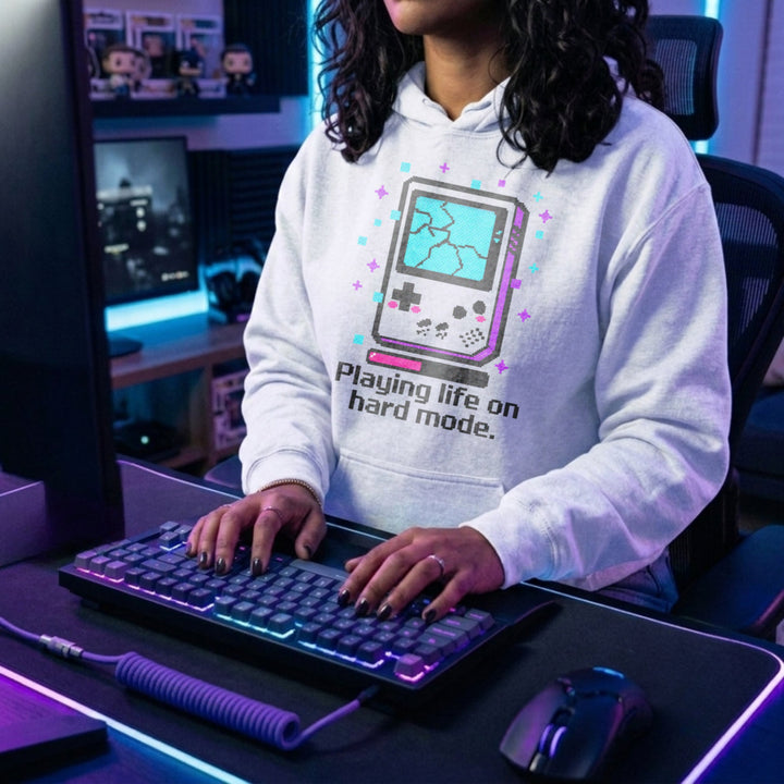Translation missing: en.White Pullover Hoodie Retro Glitch Handheld Gamer Graphic With Text, Playing Life on Hard Mode