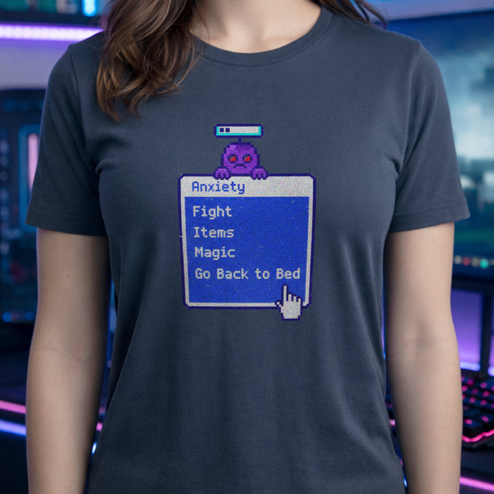 Translation missing: en.Heather navy t-shirt featuring a retro blue RPG battle menu box titled Anxiety with option Go Back to Bed