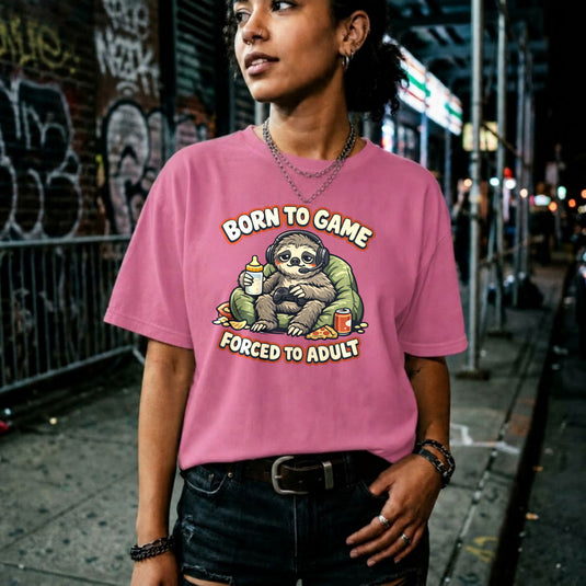 Translation missing: en.Azalea t-shirt featuring a cute sloth gamer graphic with text Born to Game Forced to Adult in orange text