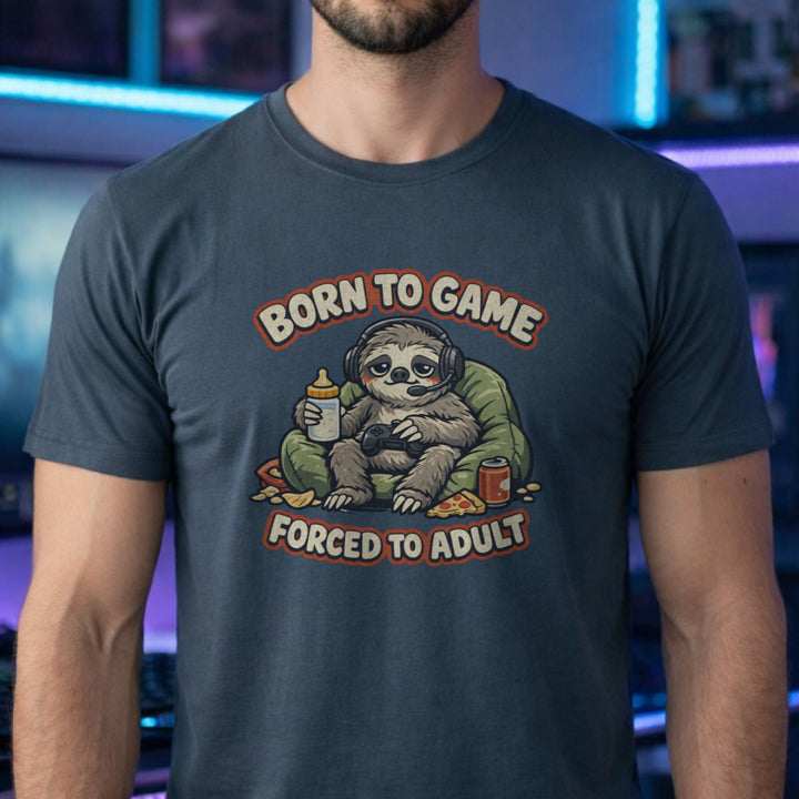 Translation missing: en.Dark Heather t-shirt featuring a cute sloth gamer graphic with text Born to Game Forced to Adult in orange text
