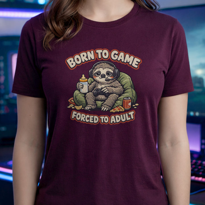 Translation missing: en.Maroon t-shirt featuring a cute sloth gamer graphic with text Born to Game Forced to Adult in orange text