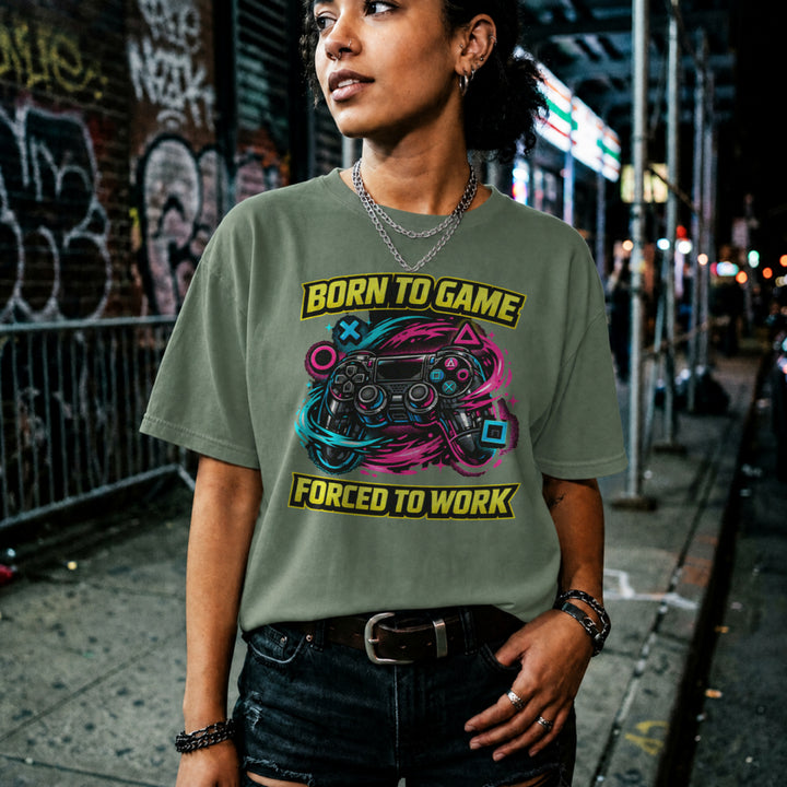 Translation missing: en.Military green t-shirt with a neon controller graphic and yellow text Born to Game Forced to Work in banner fonts