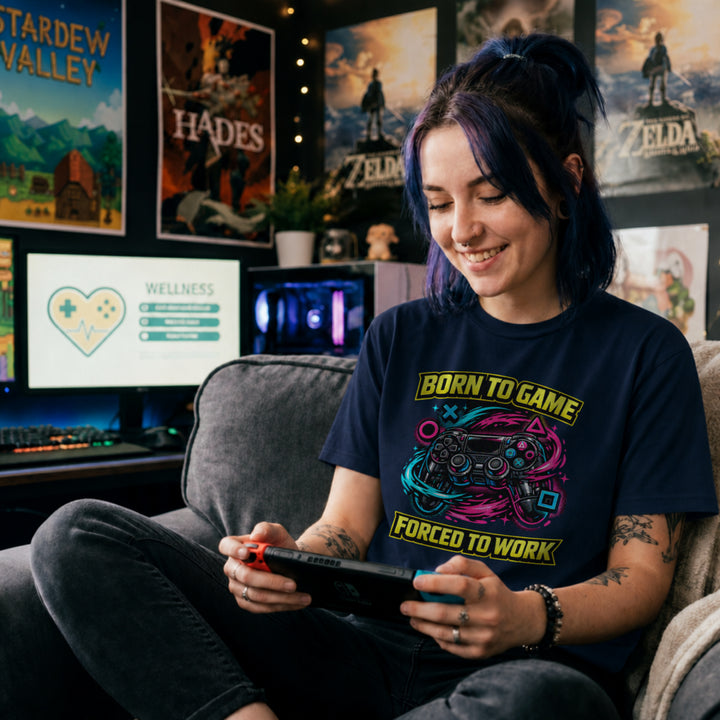 Translation missing: en.Navy t-shirt with a neon controller graphic and yellow text Born to Game Forced to Work in banner fonts