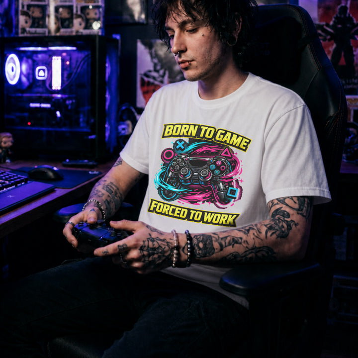 Translation missing: en.White t-shirt with a neon controller graphic and yellow text Born to Game Forced to Work in banner fonts