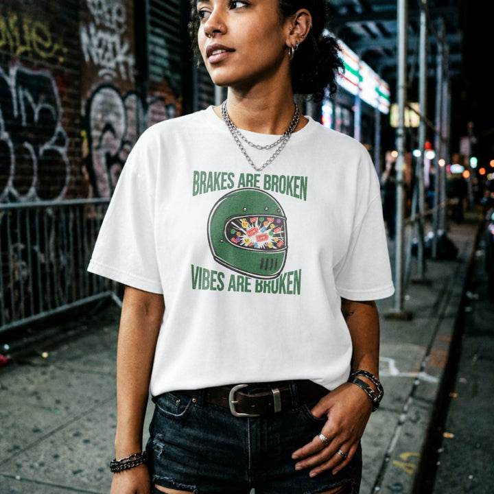 Translation missing: en.Green racing helmet graphic on a white t-shirt with text Brakes Are Broken Vibes Are Broken