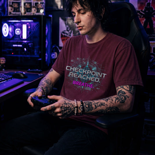 Translation missing: en.Maroon t-shirt with cyan tech HUD graphic reading "CHECKPOINT REACHED." and pink text reading "BREATHE."