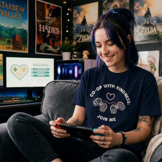 Translation missing: en.Navy t-shirt graphic with two video game controllers connected by a cord forming a heart reading CO-OP WITH KINDNESS