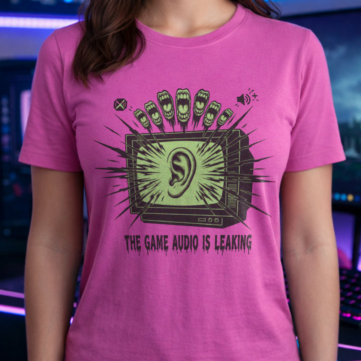 Translation missing: en.Azalea t-shirt with a green retro TV displaying a large ear graphic and text reading THE GAME AUDIO IS LEAKING
