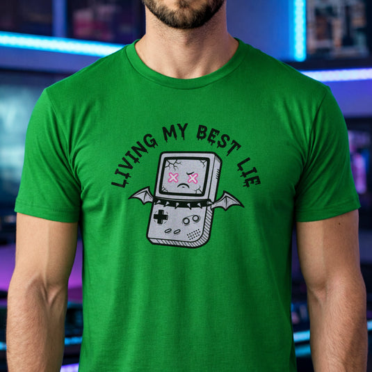 Translation missing: en.Irish green  t-shirt with a cracked retro handheld console graphic with bat wings and text Living My Best Lie