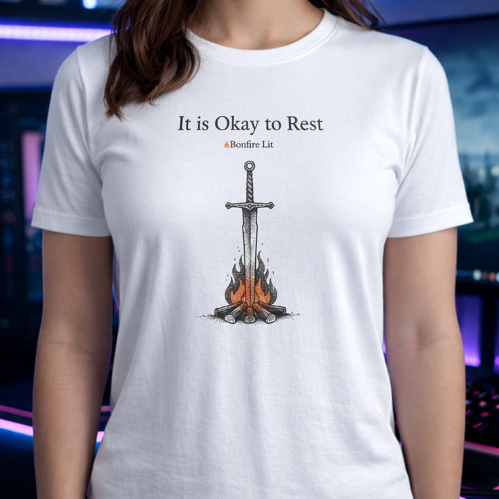 Translation missing: en.White t-shirt with a sword in a bonfire graphic and text reading It is Okay to Rest and Bonfire Lit