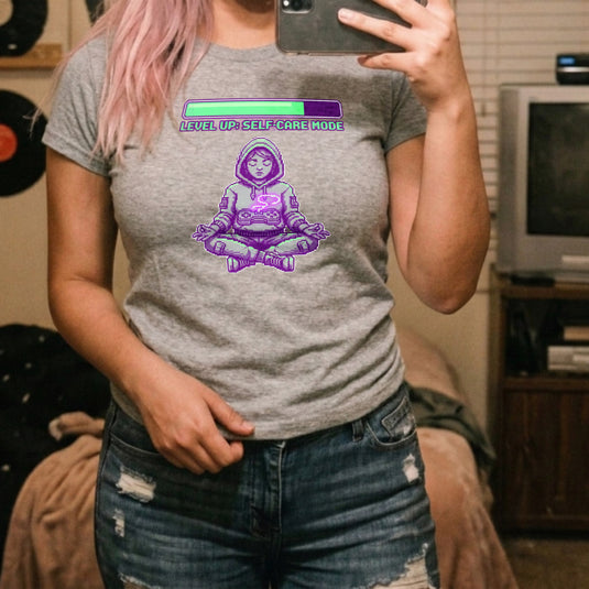 Translation missing: en.Alt n Vibe sports grey women's t-shirt with a pixel art girl meditating in a hoodie under a Level Up Self Care Mode loading bar