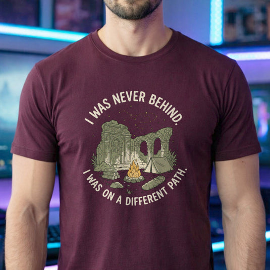 Translation missing: en.Maroon t-shirt with RPG campfire ruins illustration and text I Was Never Behind I Was On A Different Path