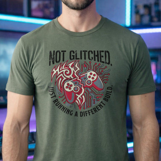 Translation missing: en.Military green t-shirt with a brain circuit board, gaming controller graphic, and Running a Different Build text
