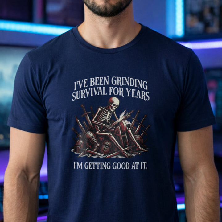 Translation missing: en.Navy t-shirt with skeleton warrior sharpening dagger on grindstone graphic and text: Grinding survival for years
