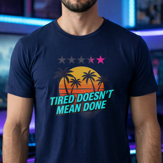 Translation missing: en.Navy t-shirt with retro palm tree sunset graphic and text: Tired Doesn't Mean Done with 5-star rating graphic