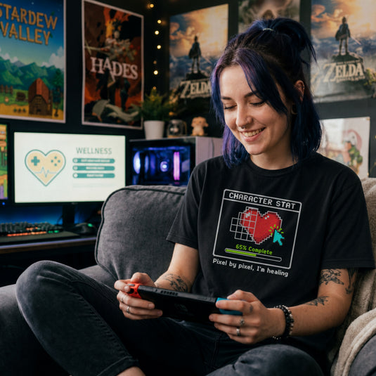 Translation missing: en.Black t-shirt with pixel art heart stat box reading 65% Complete and text Pixel by pixel, I'm healing