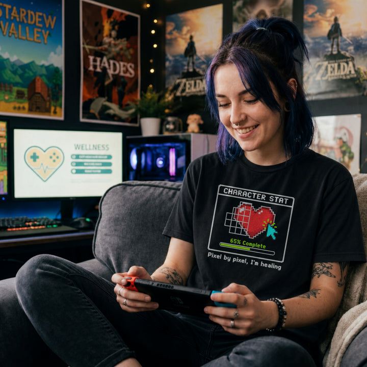 Translation missing: en.Black t-shirt with pixel art heart stat box reading 65% Complete and text Pixel by pixel, I'm healing