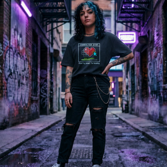 Translation missing: en.Heather navy t-shirt with pixel art heart stat box reading 65% Complete and text Pixel by pixel, I'm healing