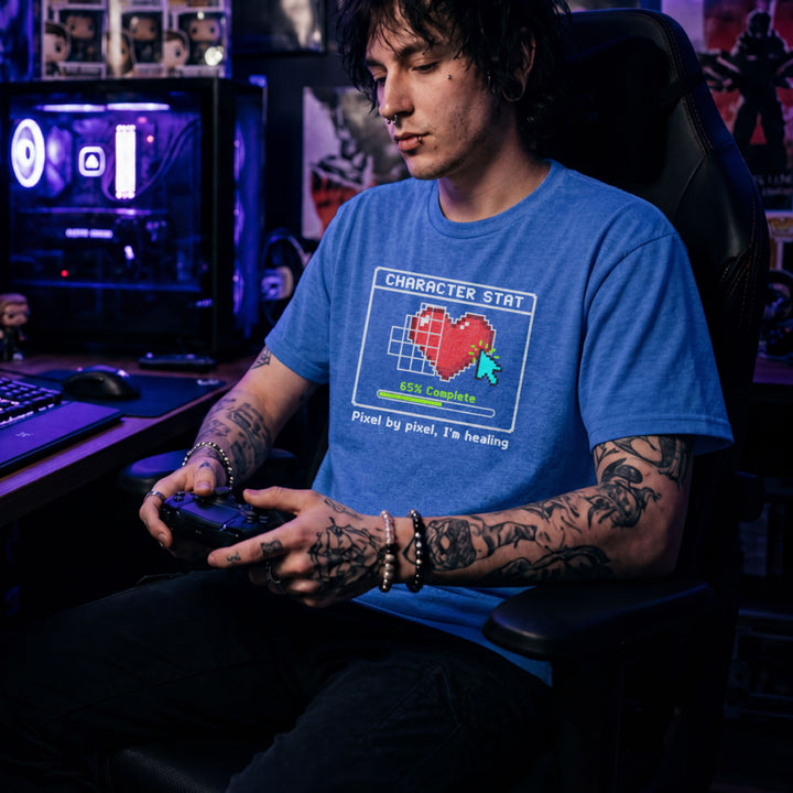 Translation missing: en.Heather royal t-shirt with pixel art heart stat box reading 65% Complete and text Pixel by pixel, I'm healing