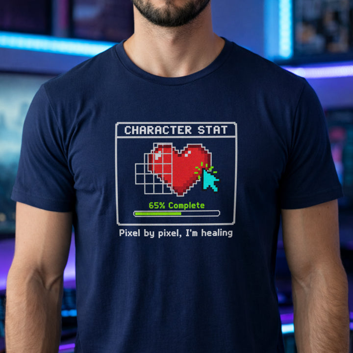 Translation missing: en.Navy t-shirt with pixel art heart stat box reading 65% Complete and text Pixel by pixel, I'm healing