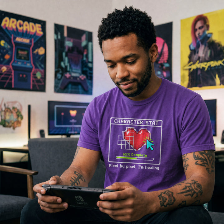 Translation missing: en.purple t-shirt with pixel art heart stat box reading 65% Complete and text Pixel by pixel, I'm healing