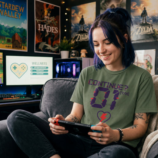 Translation missing: en.Military green retro arcade t-shirt graphic with a glitch font reading CONTINUE? [Y/N] 01 and a neon lightning bolt heart