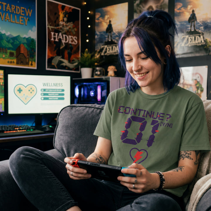 Translation missing: en.Military green retro arcade t-shirt graphic with a glitch font reading CONTINUE? [Y/N] 01 and a neon lightning bolt heart