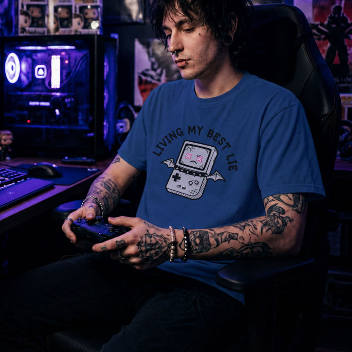 Translation missing: en.Royal t-shirt with a cracked retro handheld console graphic with bat wings and text Living My Best Lie