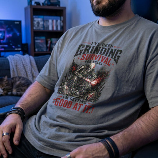 Translation missing: en.sports grey t-shirt with skeleton warrior sharpening sword on grindstone graphic and text: Grinding survival for years