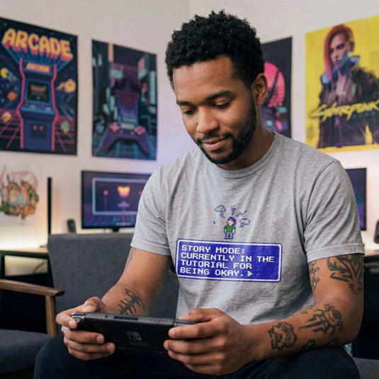 Translation missing: en.Sports grey t-shirt with pixel art character, thought cloud, and RPG text box: Story Mode tutorial for being okay