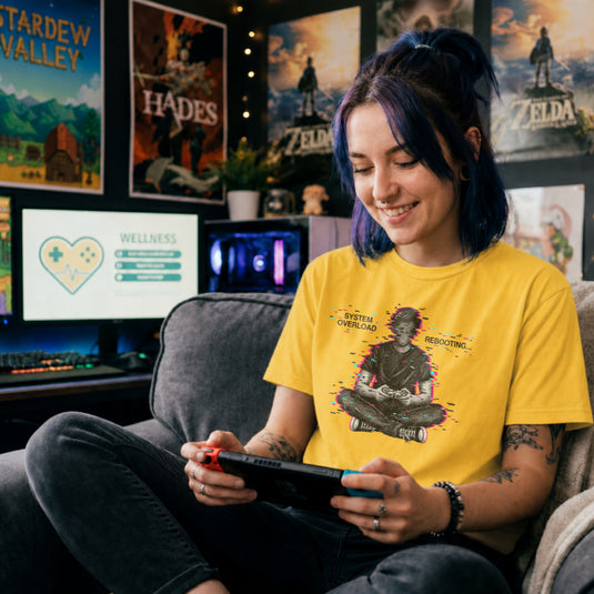 Translation missing: en.Daisy t-shirt showing a glitch art gamer sitting cross-legged with System Overload Rebooting text