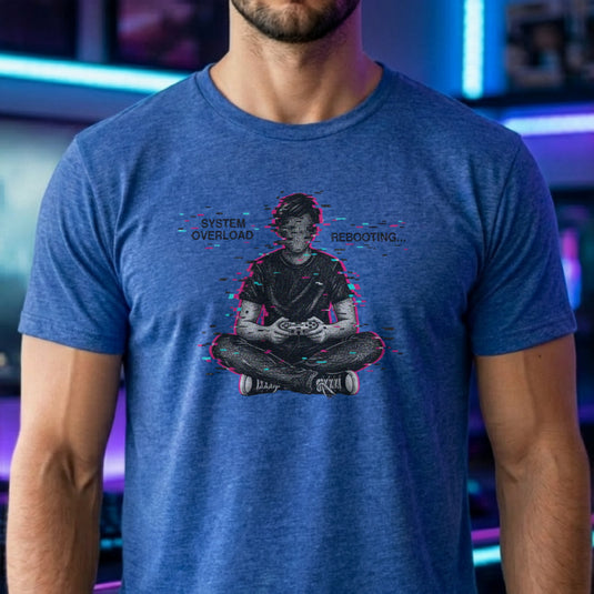 Translation missing: en.Heather royal t-shirt showing a glitch art gamer sitting cross-legged with System Overload Rebooting text