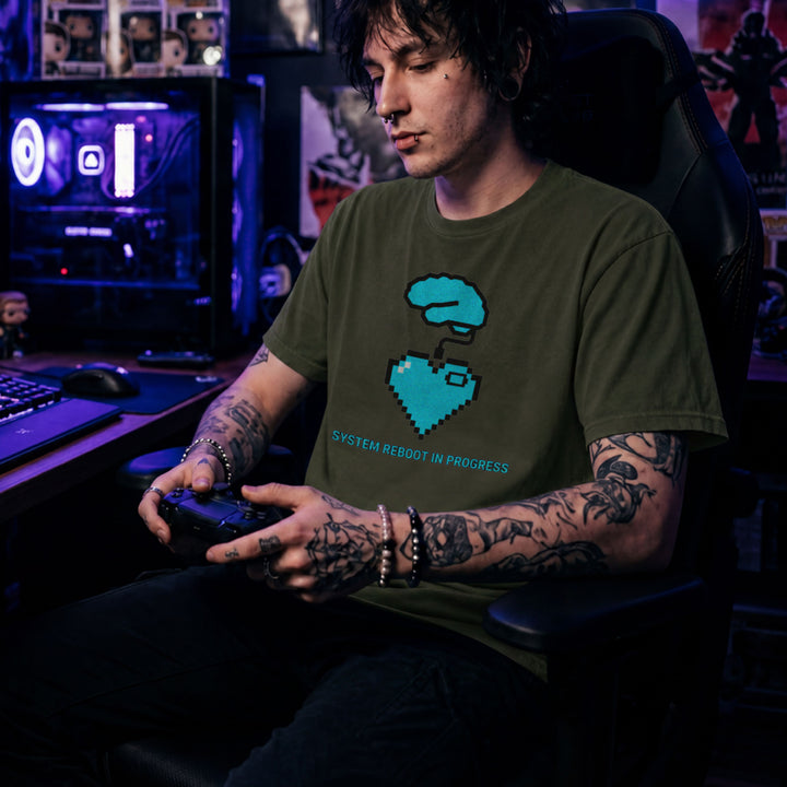 Translation missing: en.Military green t-shirt graphic with blue pixel brain and heart wire reading SYSTEM REBOOT IN PROGRESS
