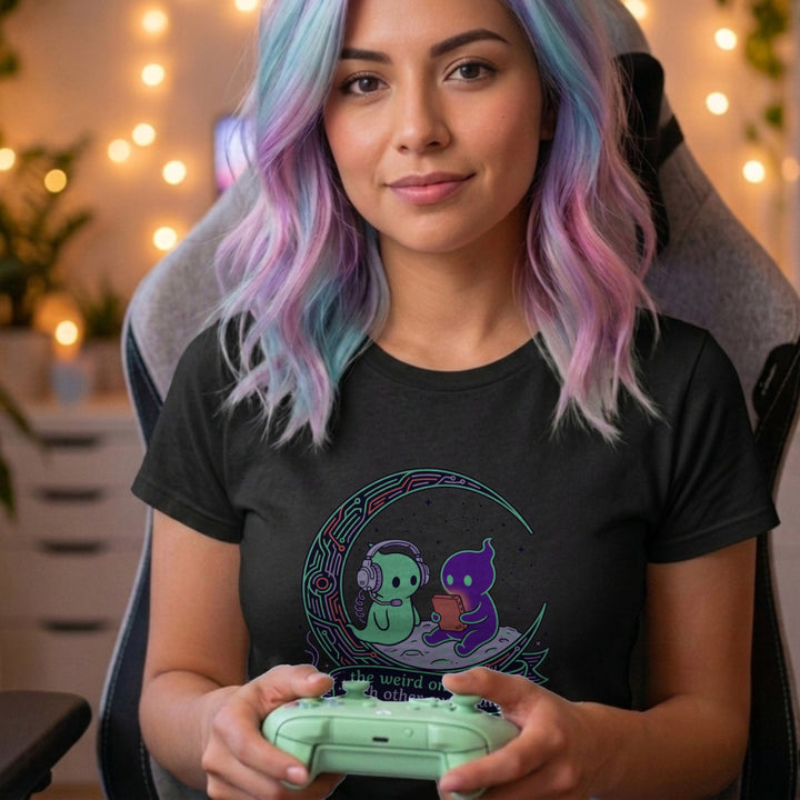 Translation missing: en.Alt n Vibe black women's t-shirt with two cute alien characters playing games under stars reading The Weird Ones Find Each Other