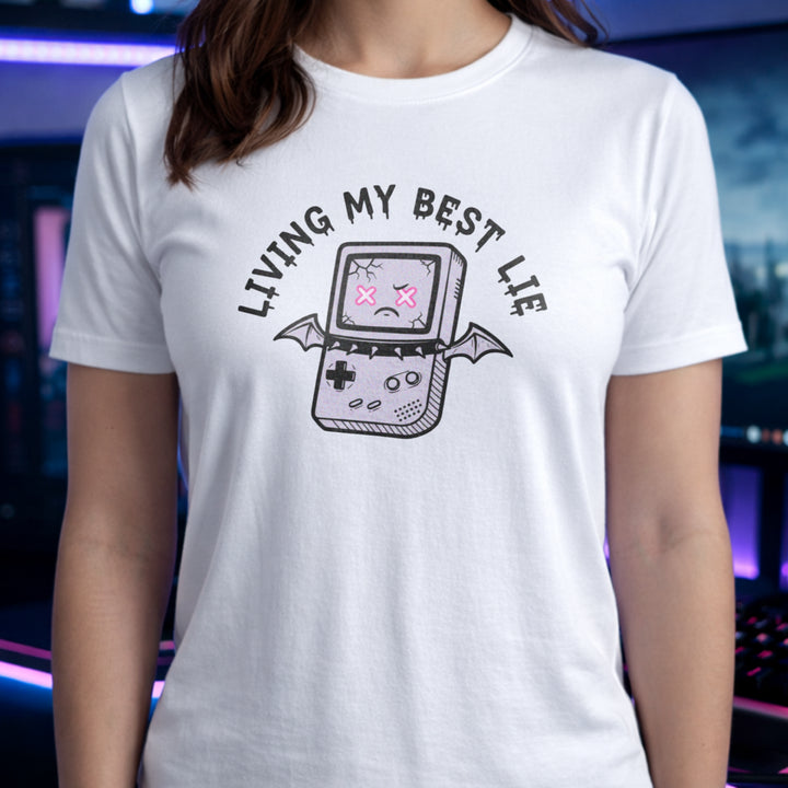 Translation missing: en.White t-shirt with a cracked retro handheld console graphic with bat wings and text Living My Best Lie